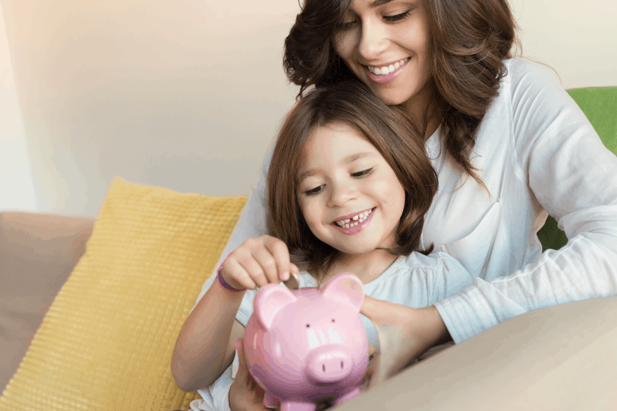 mom and child with a piggy bank
